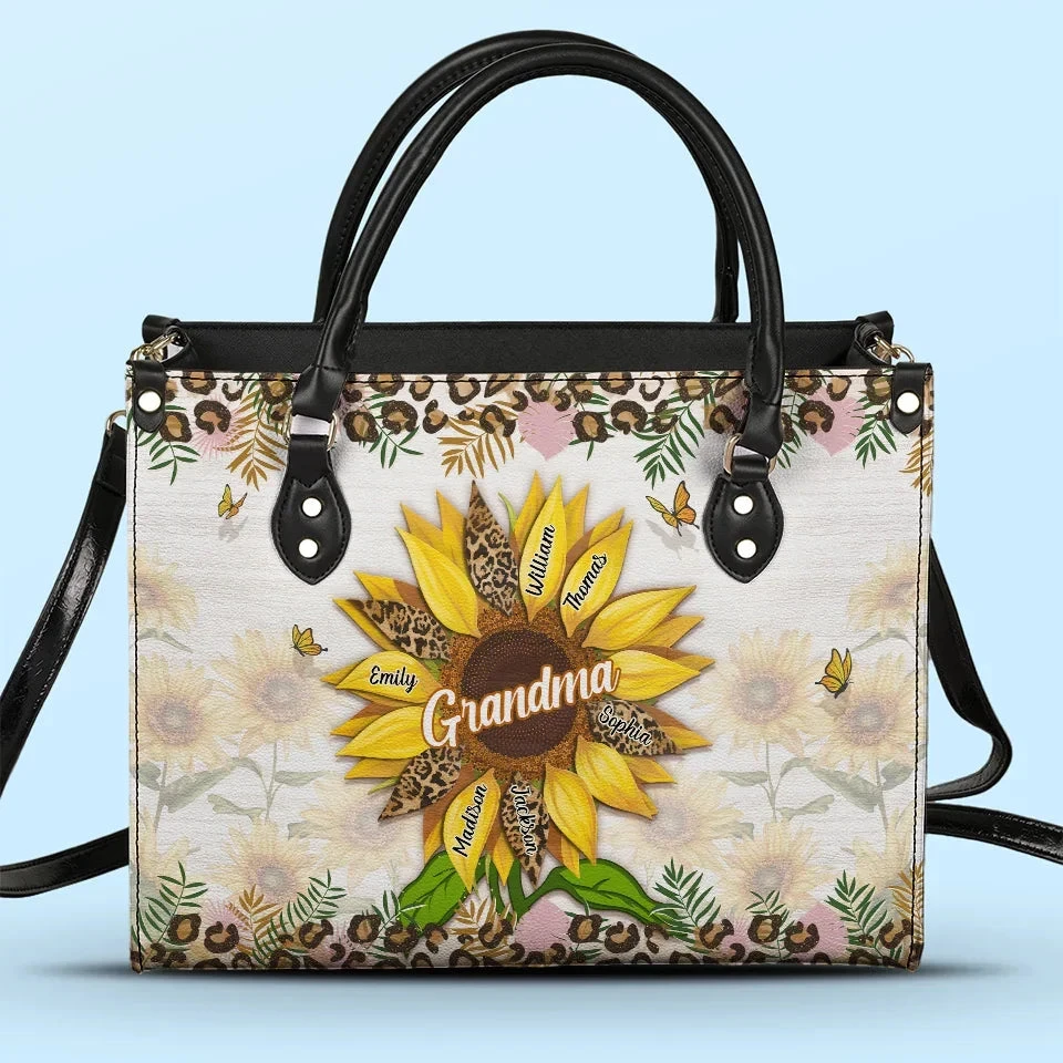 Grandma’s Embrace Is A Sanctuary For Love - Family Personalized Custom Leather Handbag - Gift For Mom, Grandma 1 Grandma’s Embrace Is A Sanctuary For Love - Family Personalized Custom Leather Handbag - Gift For Mom, Grandma